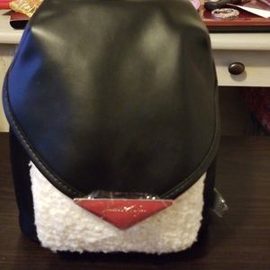 Mini black and white back pack.